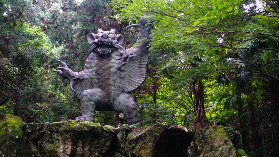 A demon statue in the woods, found on the Shikoku 88 temple trail